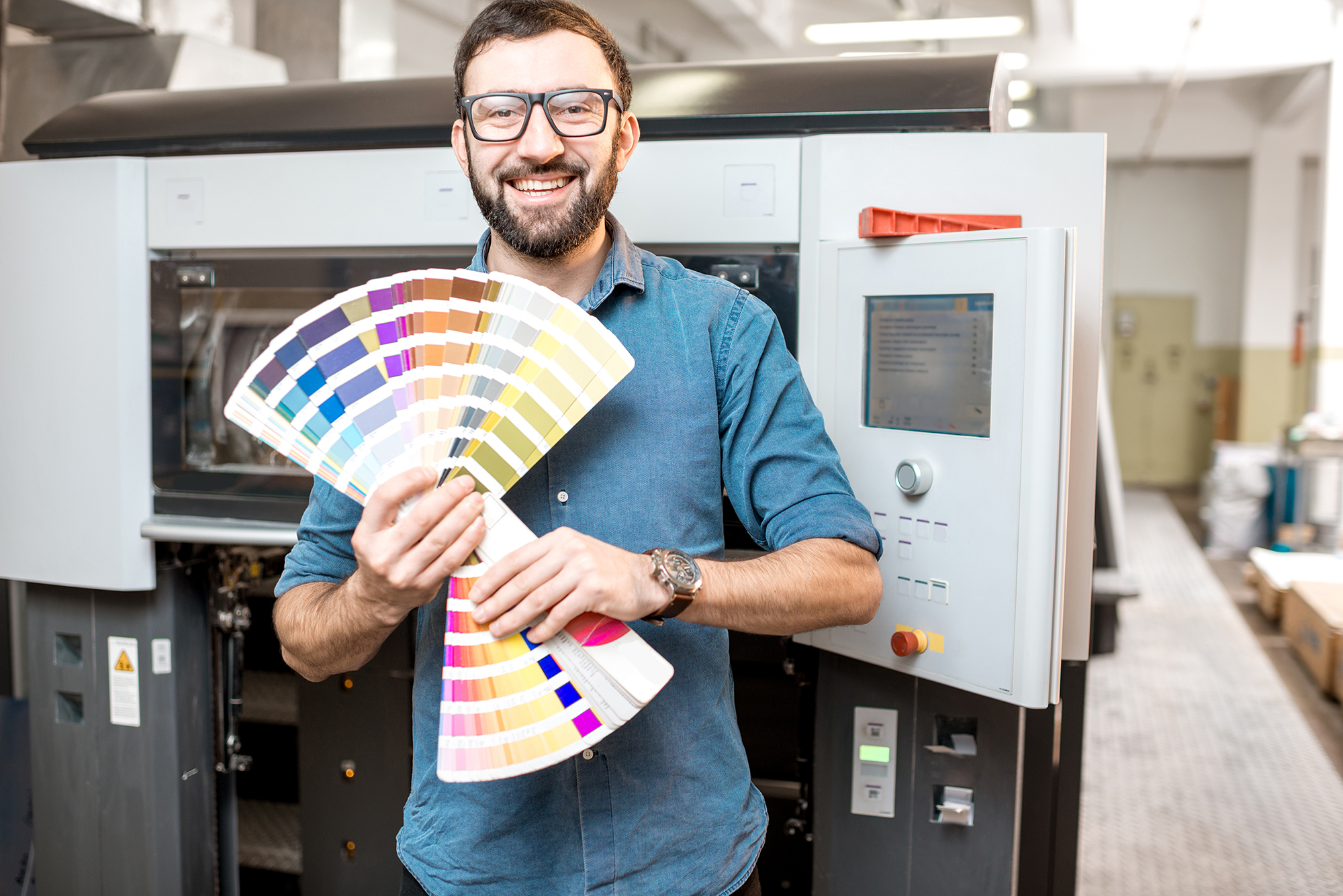 Typographer With Color Swatches At The Manufacturing